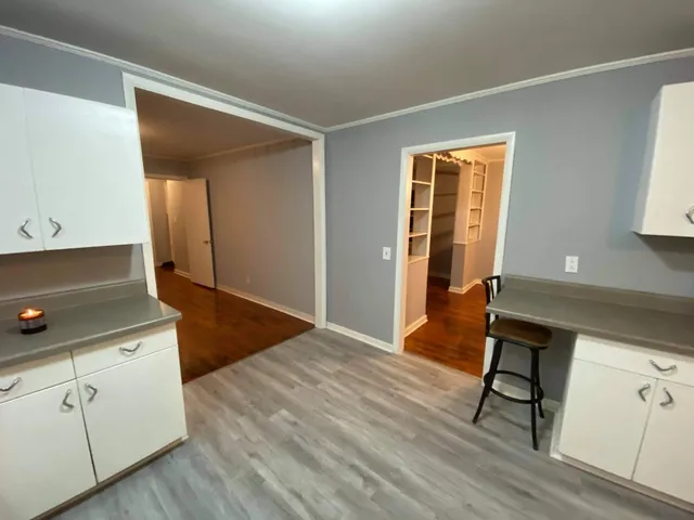 a view of a livingroom with wooden floor