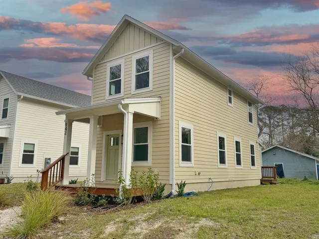 a front view of a house with a yard