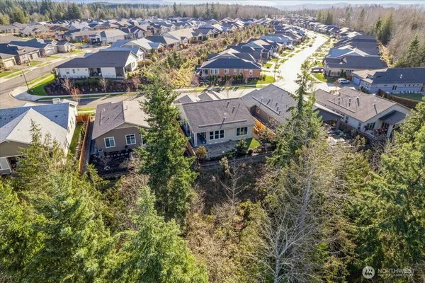 an aerial view of residential houses with outdoor space