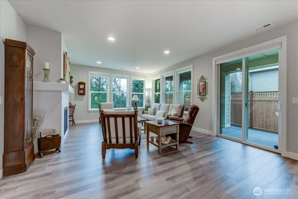 a dining room with furniture and wooden floor