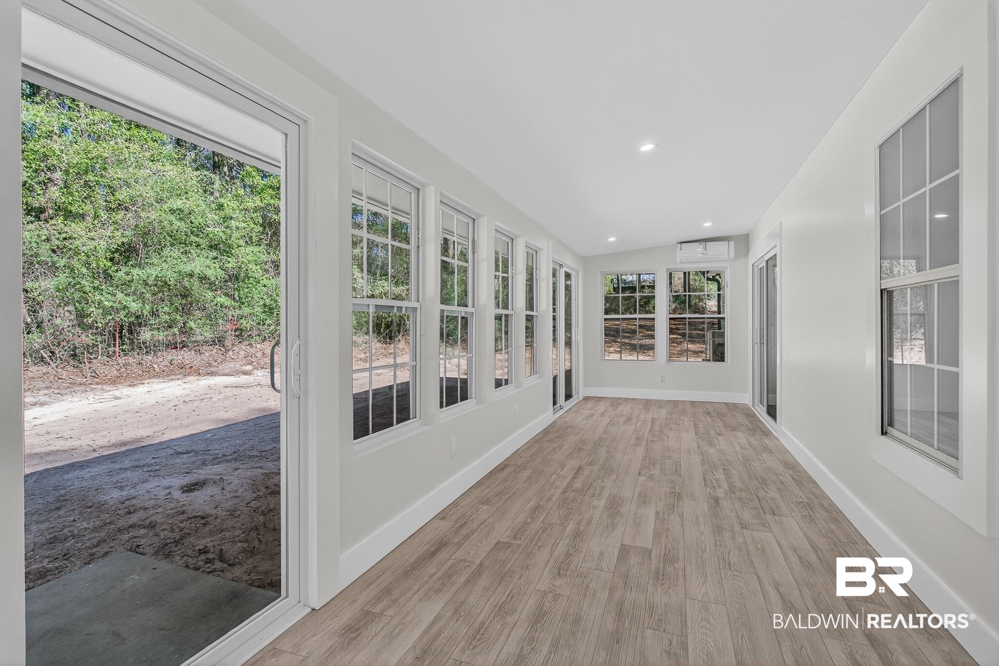 10650 Old Pascagoula Road Theodore, AL 36582 - Photo 74 of 77 Unfurnished sunroom featuring lofted ceiling, wood finished floors, and recessed lighting