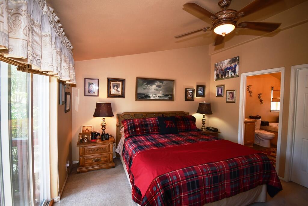 29077 Day Road McArthur, CA 96056 - Photo 23 of 58 a bedroom with a bed and a chandelier