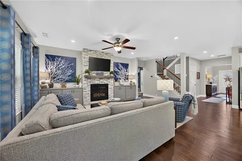 a living room with furniture and a fireplace