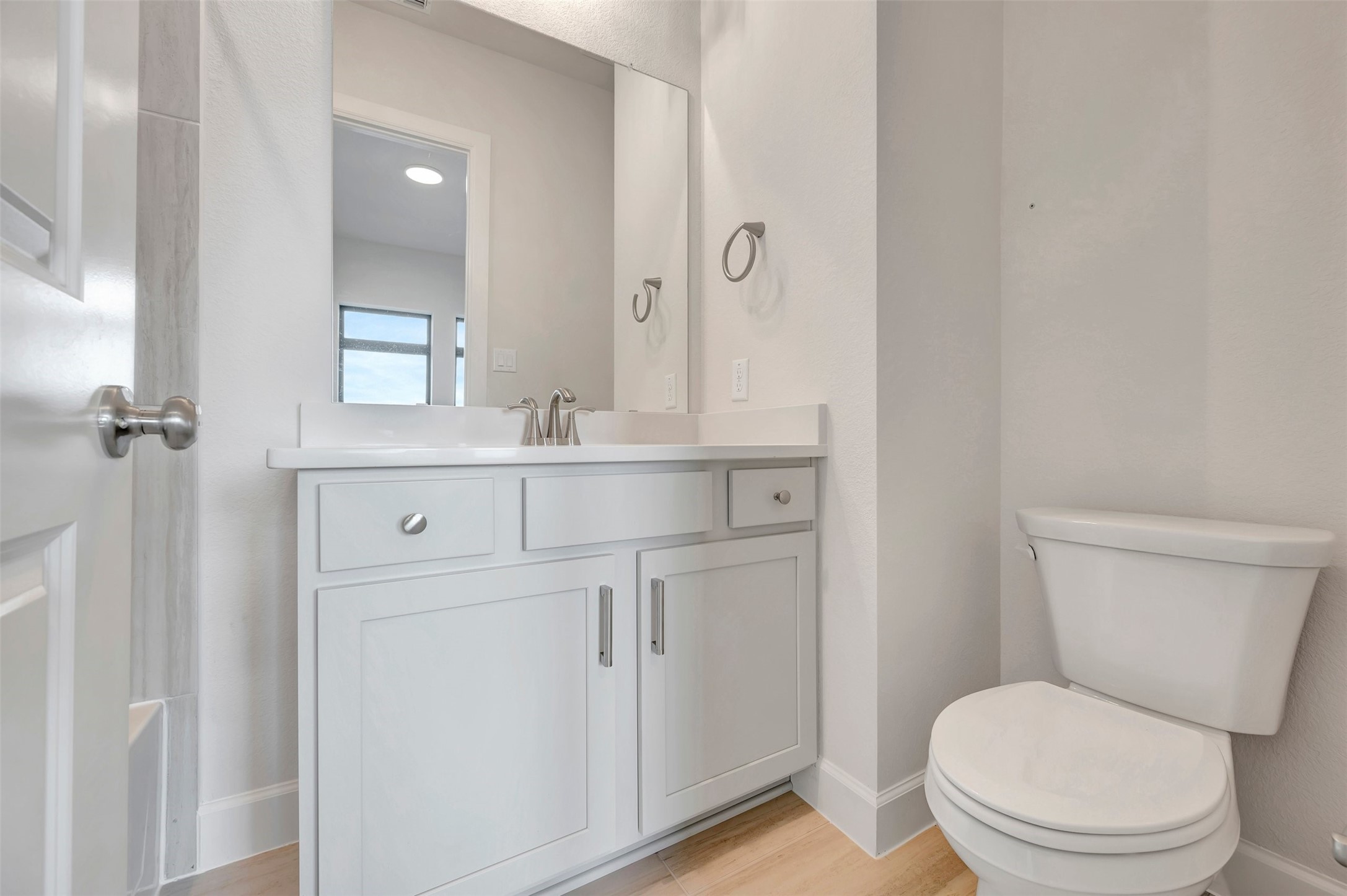 2718 Cottage Place Rosharon, TX 77583 - Photo 15 of 50 a bathroom with a toilet sink vanity and mirror