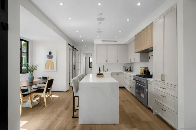 a bedroom with a bed and a table