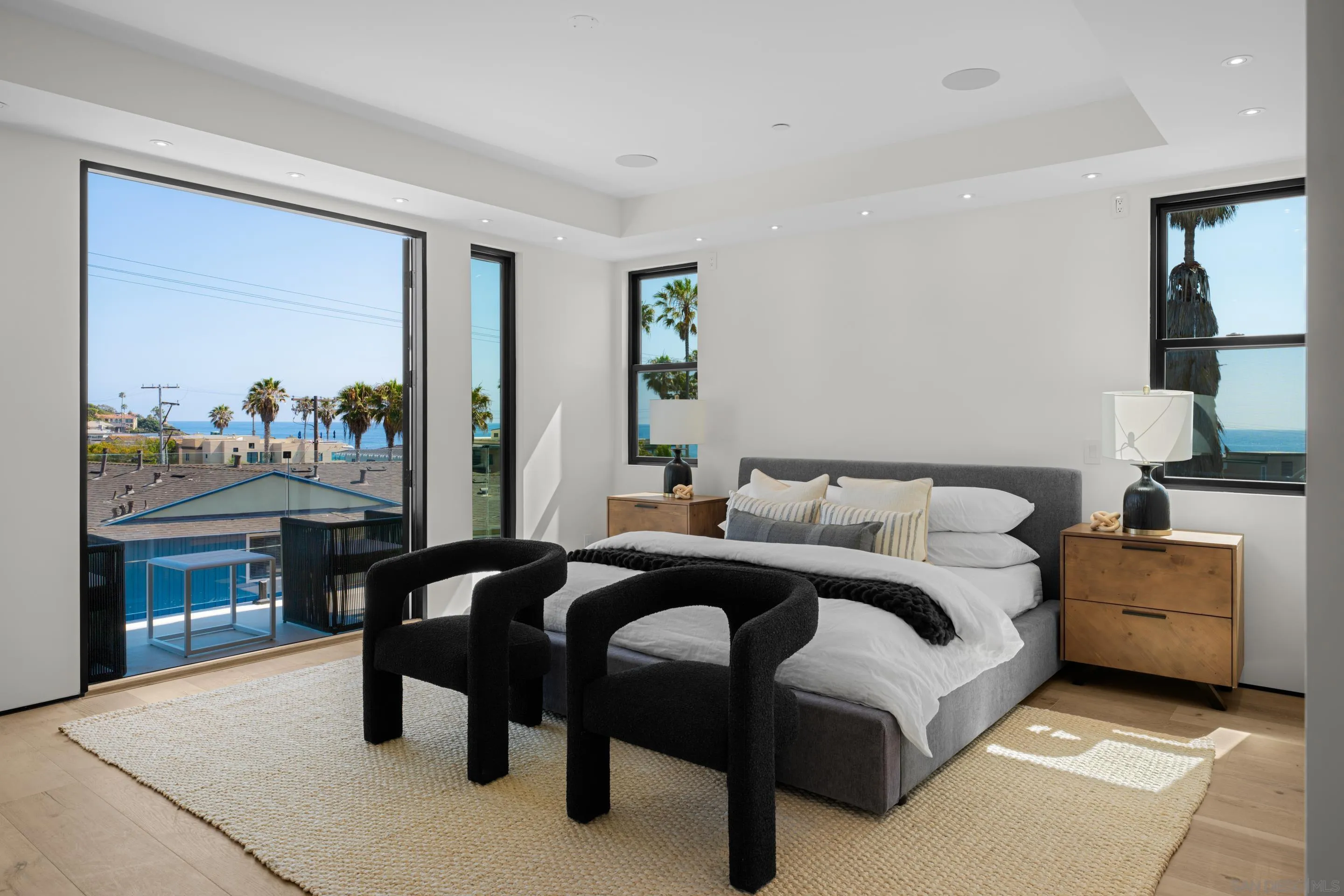 242 Playa Del Norte Street La Jolla, CA 92037 - Photo 13 of 32 a bedroom with a bed and a table