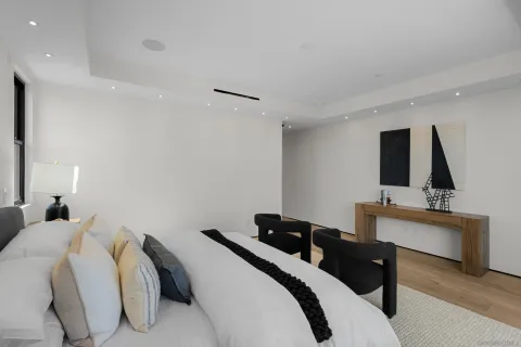 a bathroom with a granite countertop sink mirror and bathtub