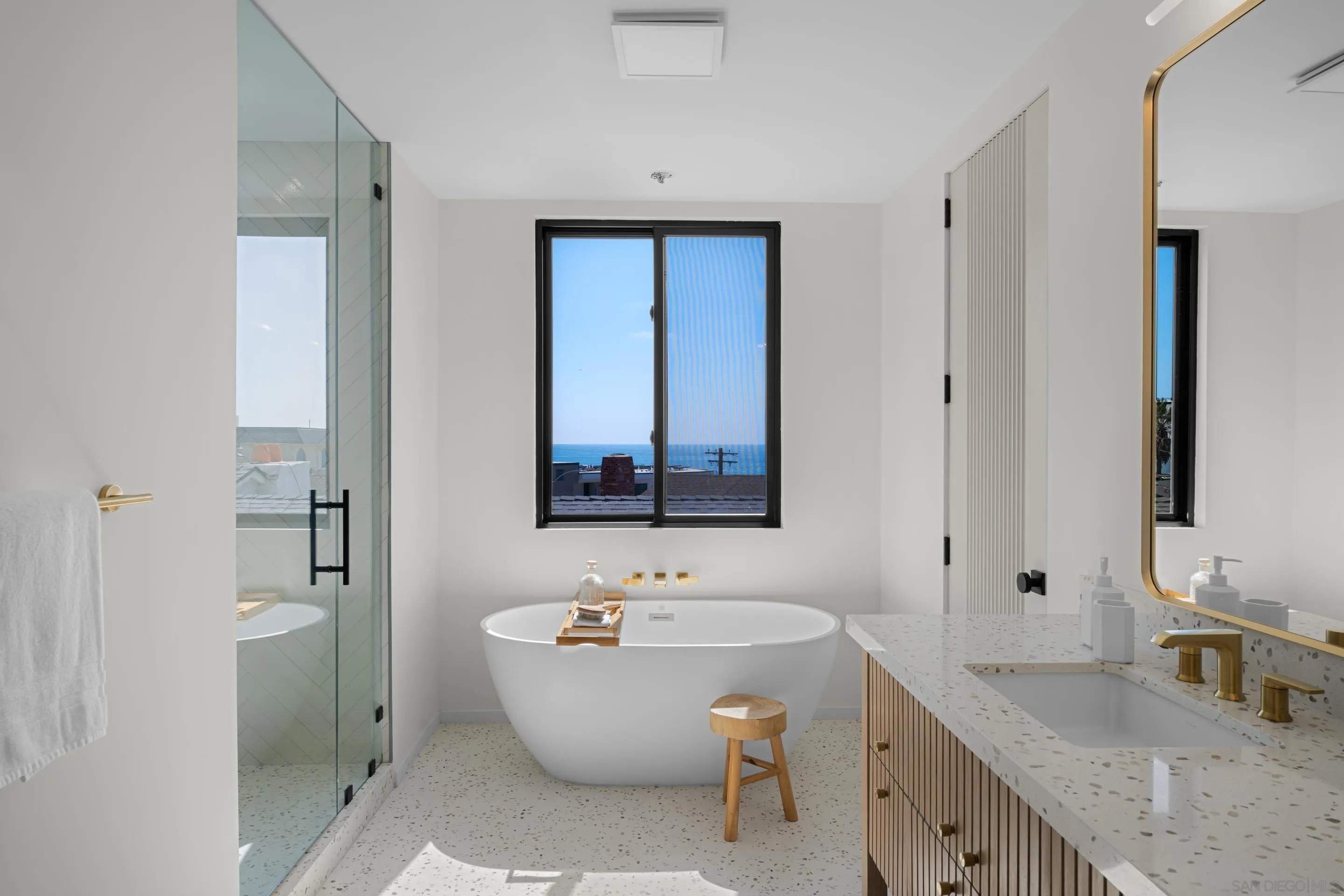 242 Playa Del Norte Street La Jolla, CA 92037 - Photo 15 of 32 a bathroom with a granite countertop sink mirror and bathtub