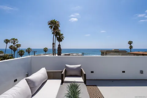 a view of city with ocean