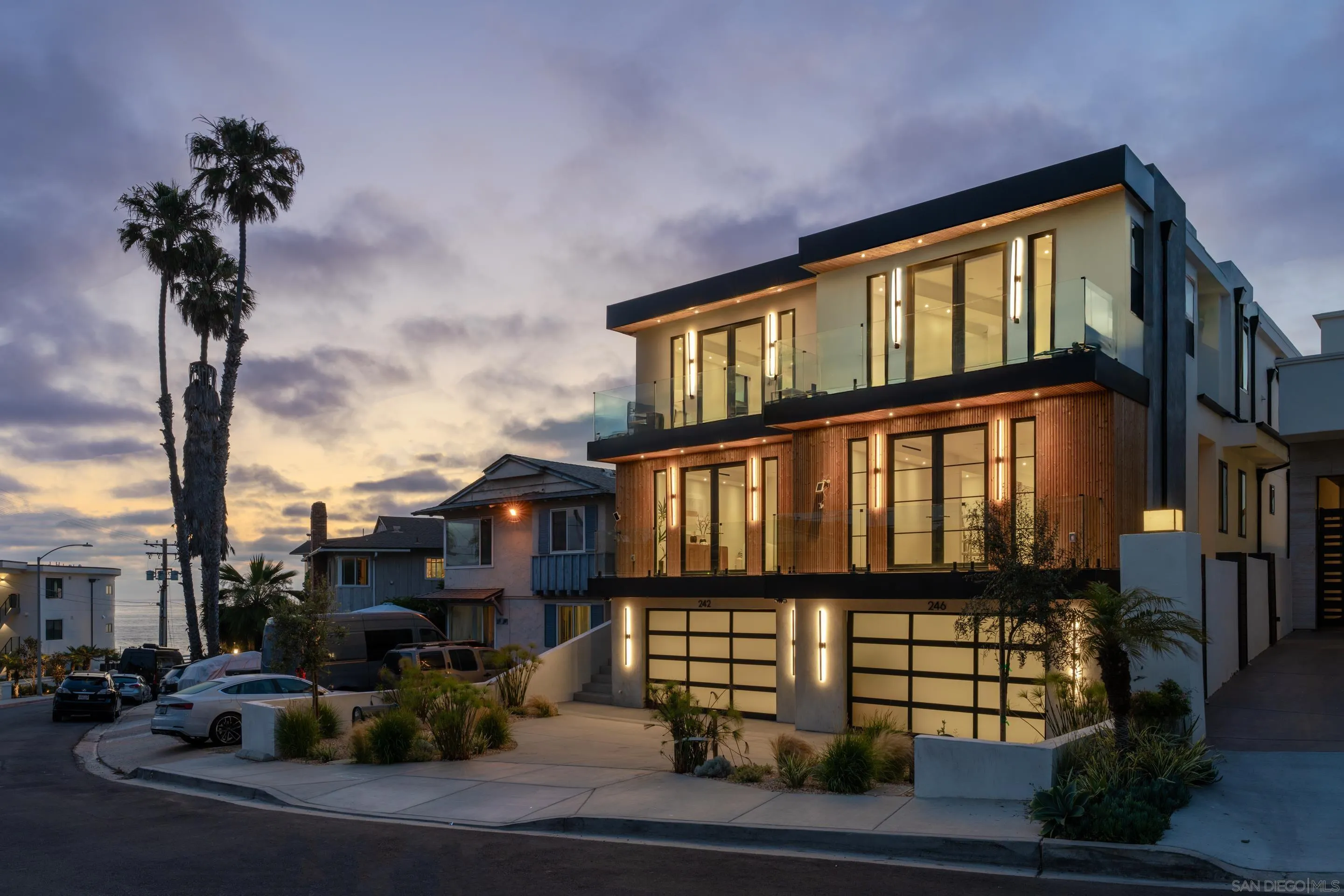 242 Playa Del Norte Street La Jolla, CA 92037 - Photo 2 of 32 a front view of a building with a garden