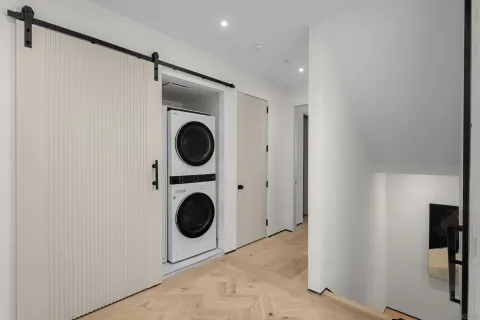 a bedroom with a bed and a lamp