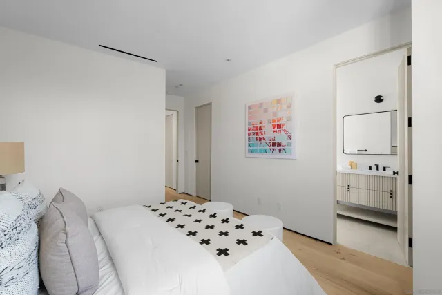 a bathroom with a bathtub shower sink vanity and toilet