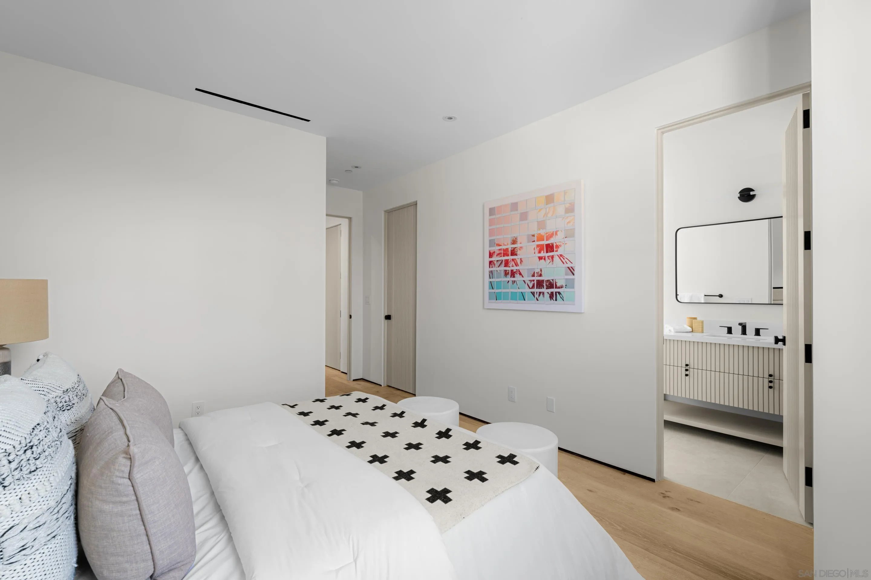 242 Playa Del Norte Street La Jolla, CA 92037 - Photo 23 of 32 a bedroom with a bed and a cabinets