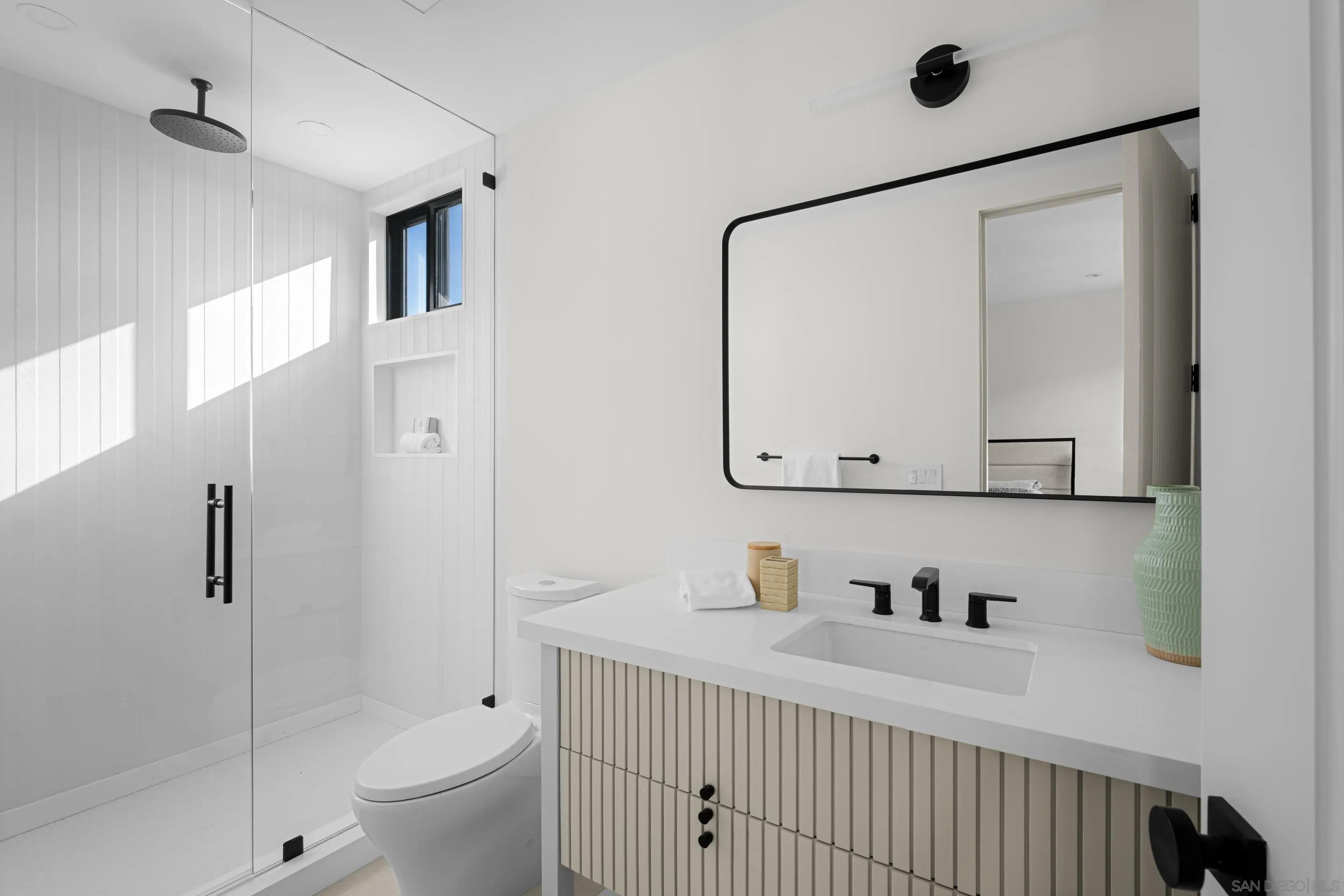 242 Playa Del Norte Street La Jolla, CA 92037 - Photo 24 of 32 a bathroom with a bathtub shower sink vanity and toilet