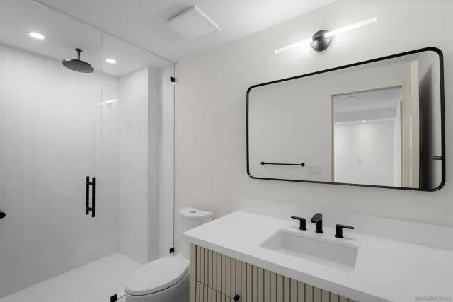 a view of a terrace with couches and lounge chairs