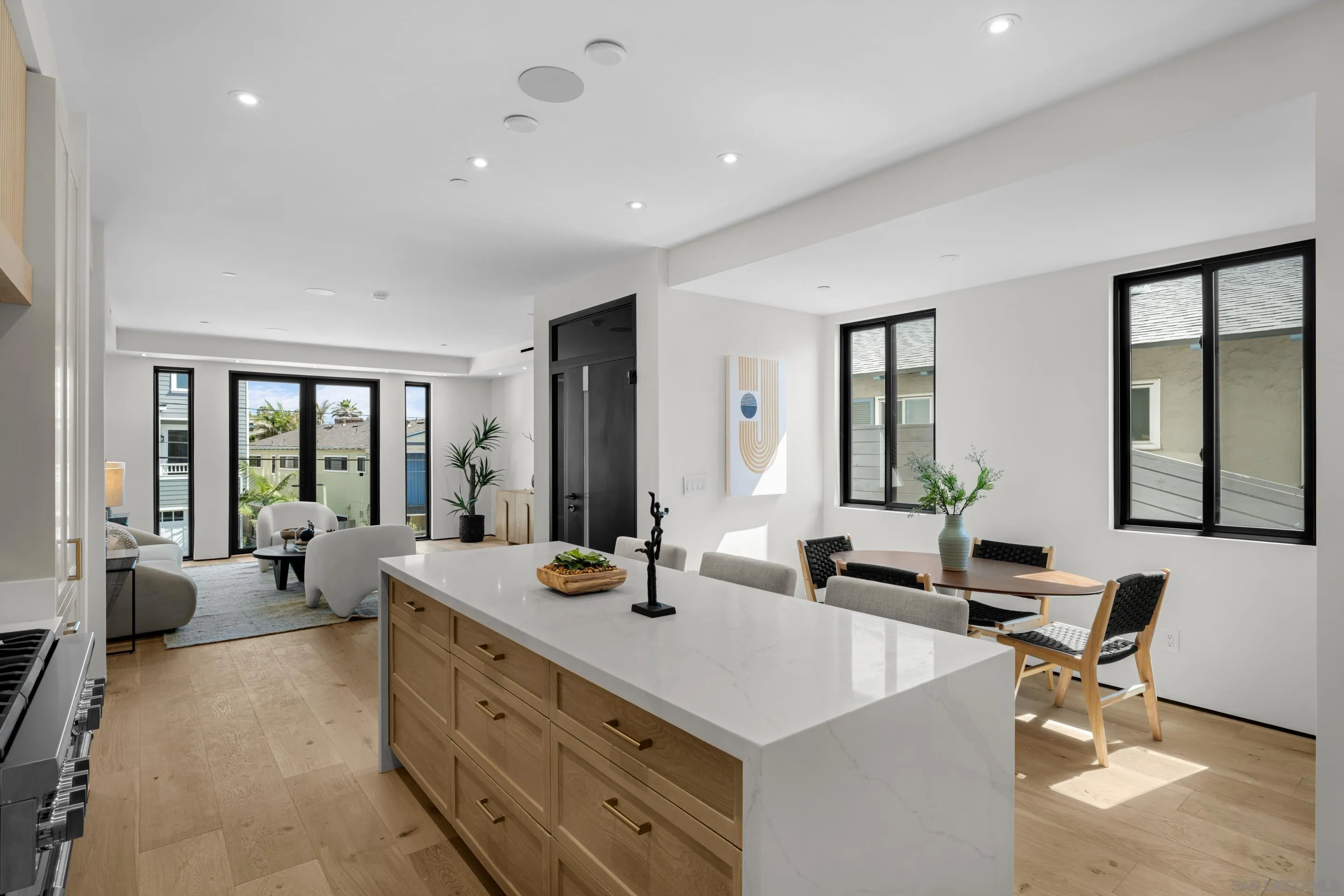 242 Playa Del Norte Street La Jolla, CA 92037 - Photo 7 of 32 a large kitchen with sink a counter top space and living room