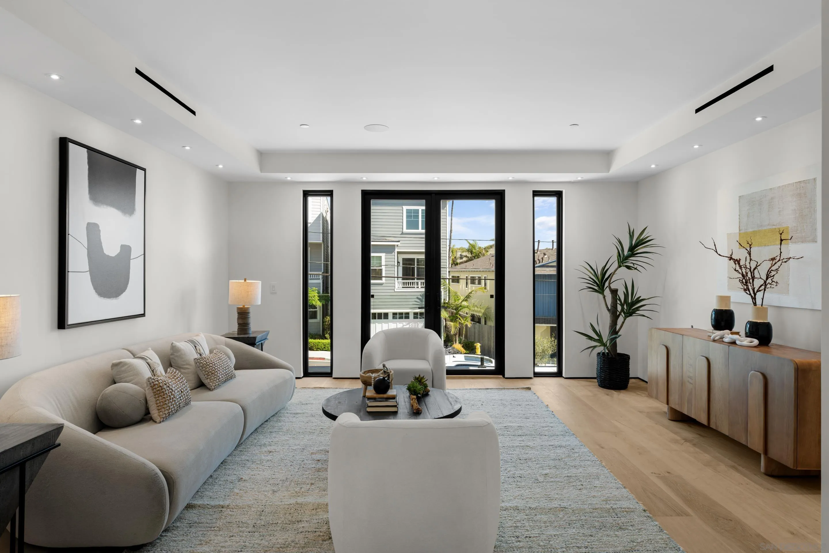 242 Playa Del Norte Street La Jolla, CA 92037 - Photo 9 of 32 a living room with furniture and a large window