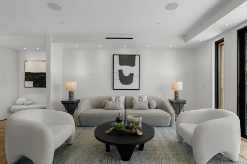 a living room with furniture and white walls