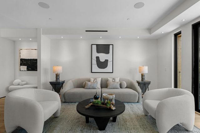 a living room with furniture and white walls