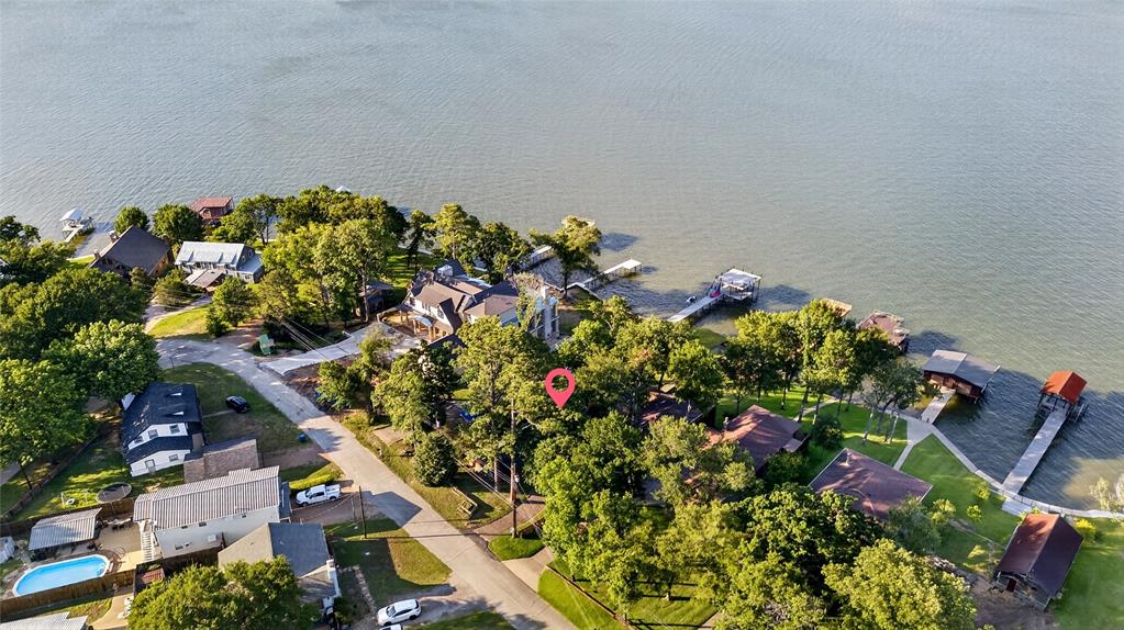 1113 Rim O The World Drive Tool, TX 75143 - Photo 37 of 40 Waterfront property featuring mature trees and a the main body of water. This residence is located in the middle of Cedar Creek Lake. Isn't that water view stunning?
