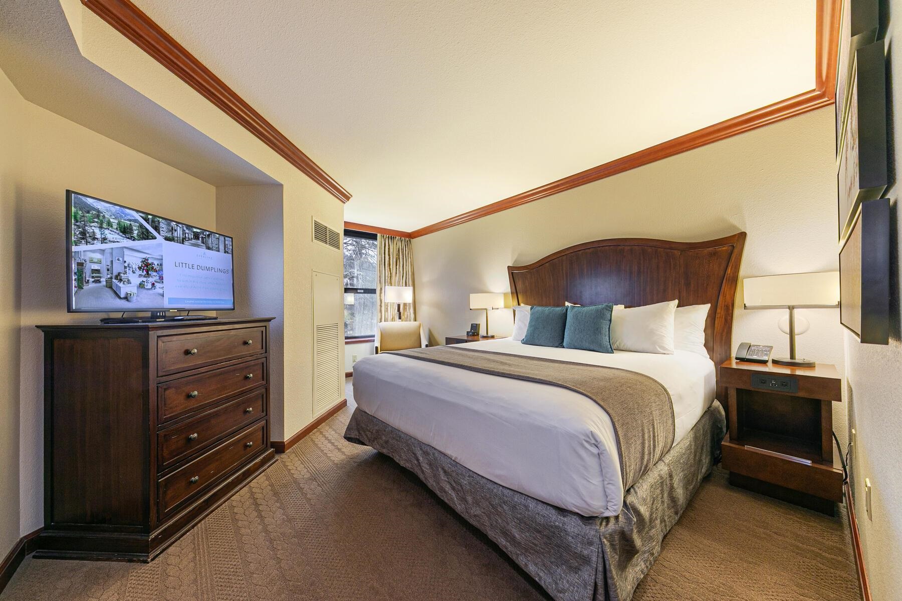 400 Resort Road, Unit 418420 Olympic Valley, CA 96146 - Photo 13 of 26 a bedroom with a bed and a flat screen tv