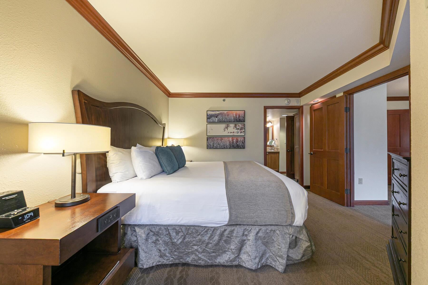 400 Resort Road, Unit 418420 Olympic Valley, CA 96146 - Photo 14 of 26 a bedroom with a large bed and a dresser