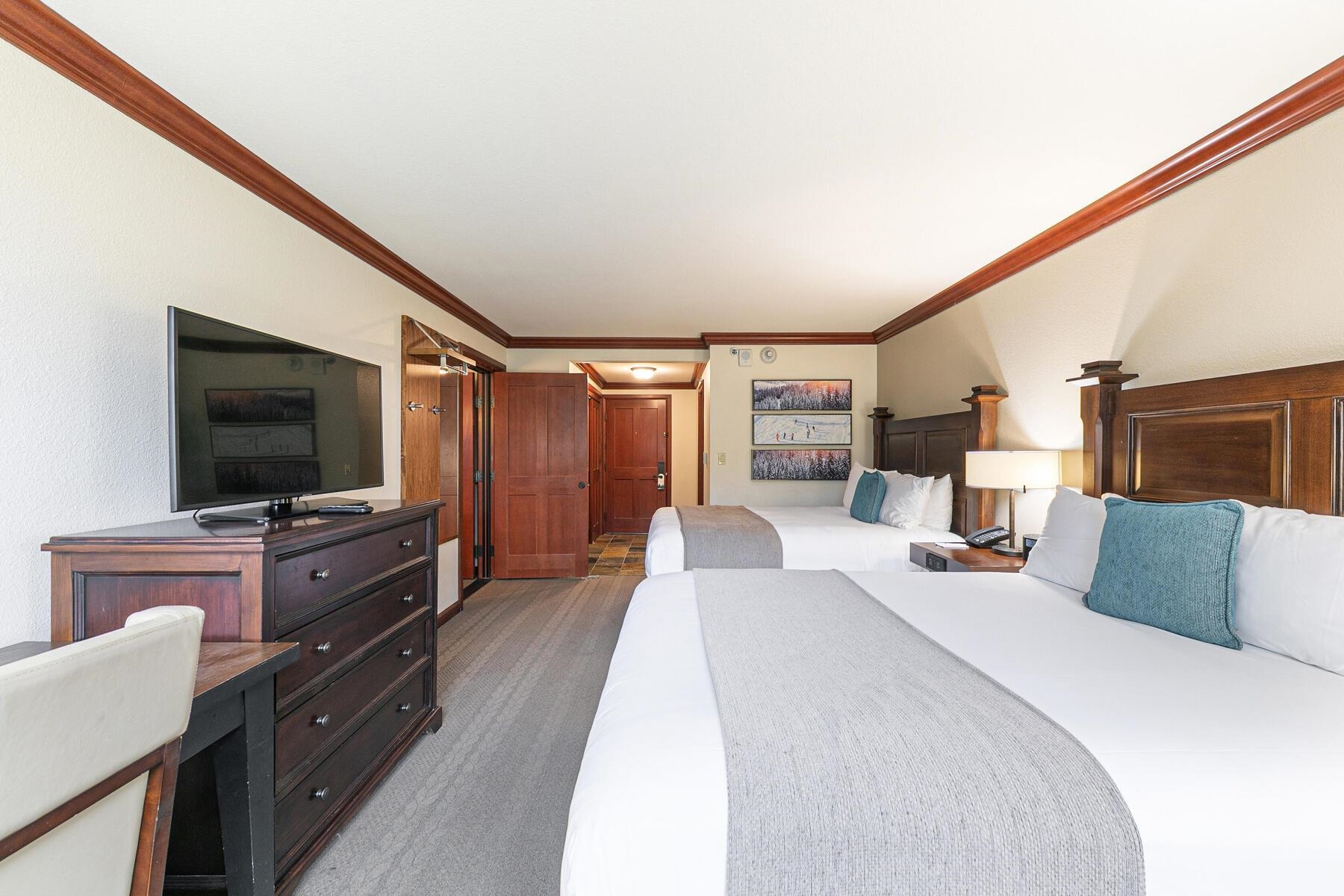 400 Resort Road, Unit 418420 Olympic Valley, CA 96146 - Photo 18 of 26 a bedroom with furniture and a flat screen tv