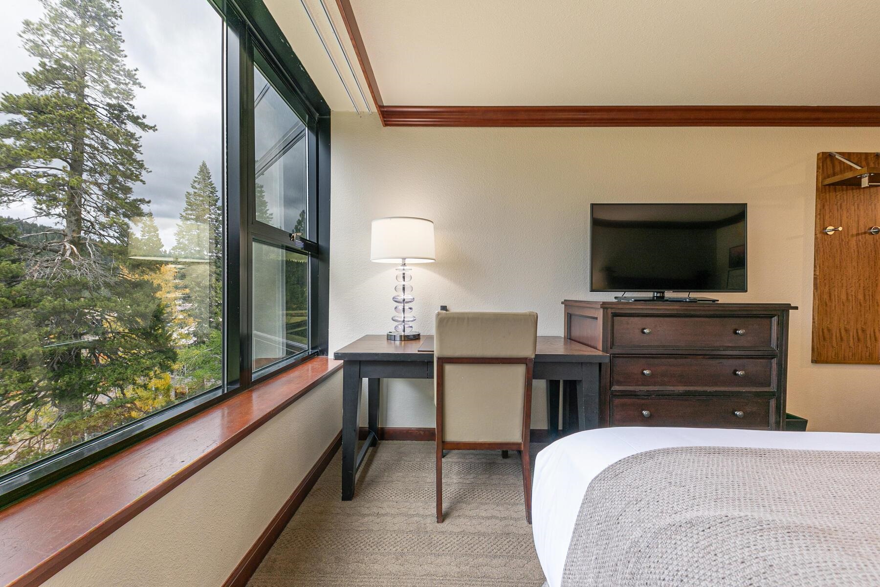 400 Resort Road, Unit 418420 Olympic Valley, CA 96146 - Photo 19 of 26 a bedroom with a bed and a flat screen tv