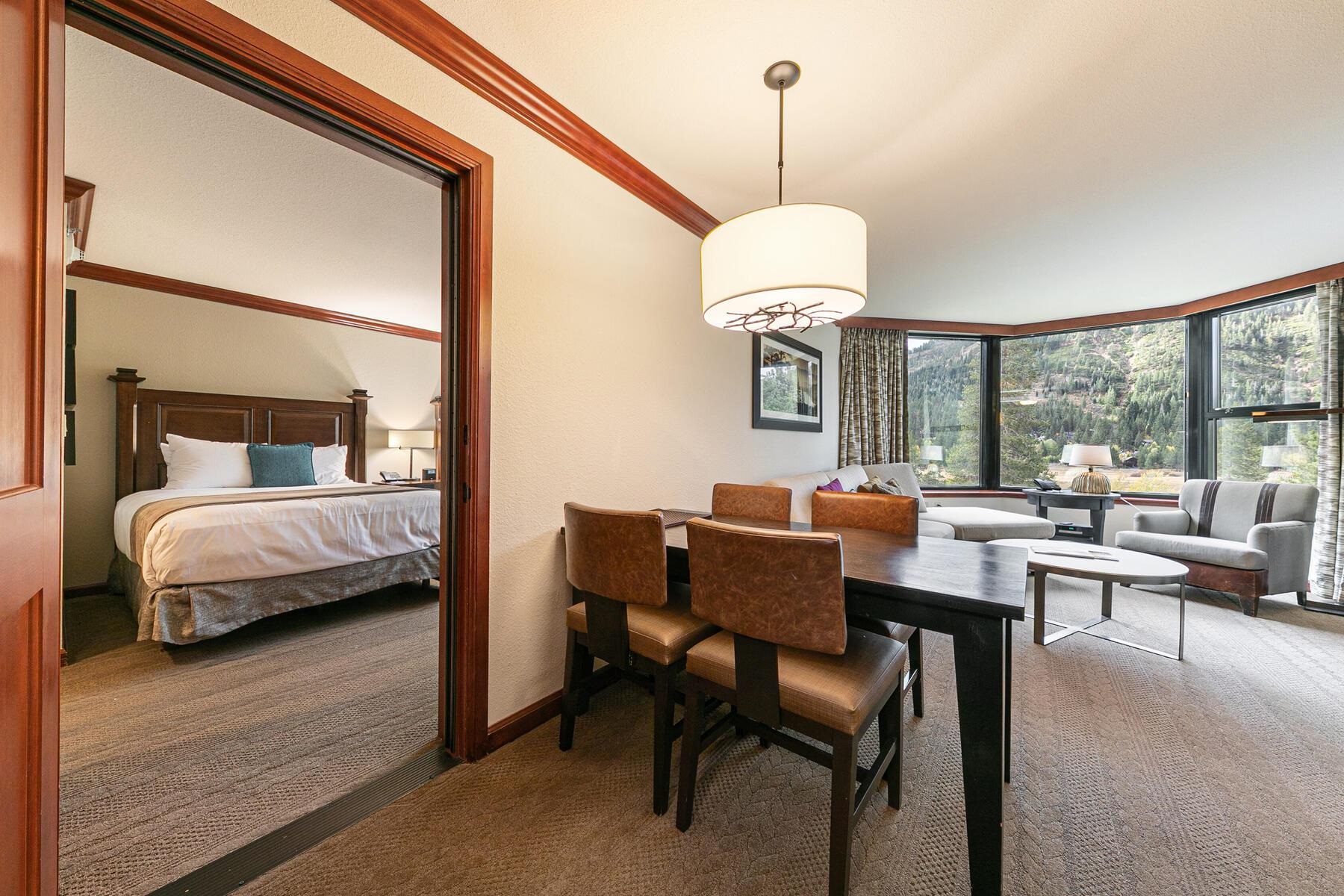 400 Resort Road, Unit 418420 Olympic Valley, CA 96146 - Photo 2 of 26 a bedroom with a bed and a chandelier