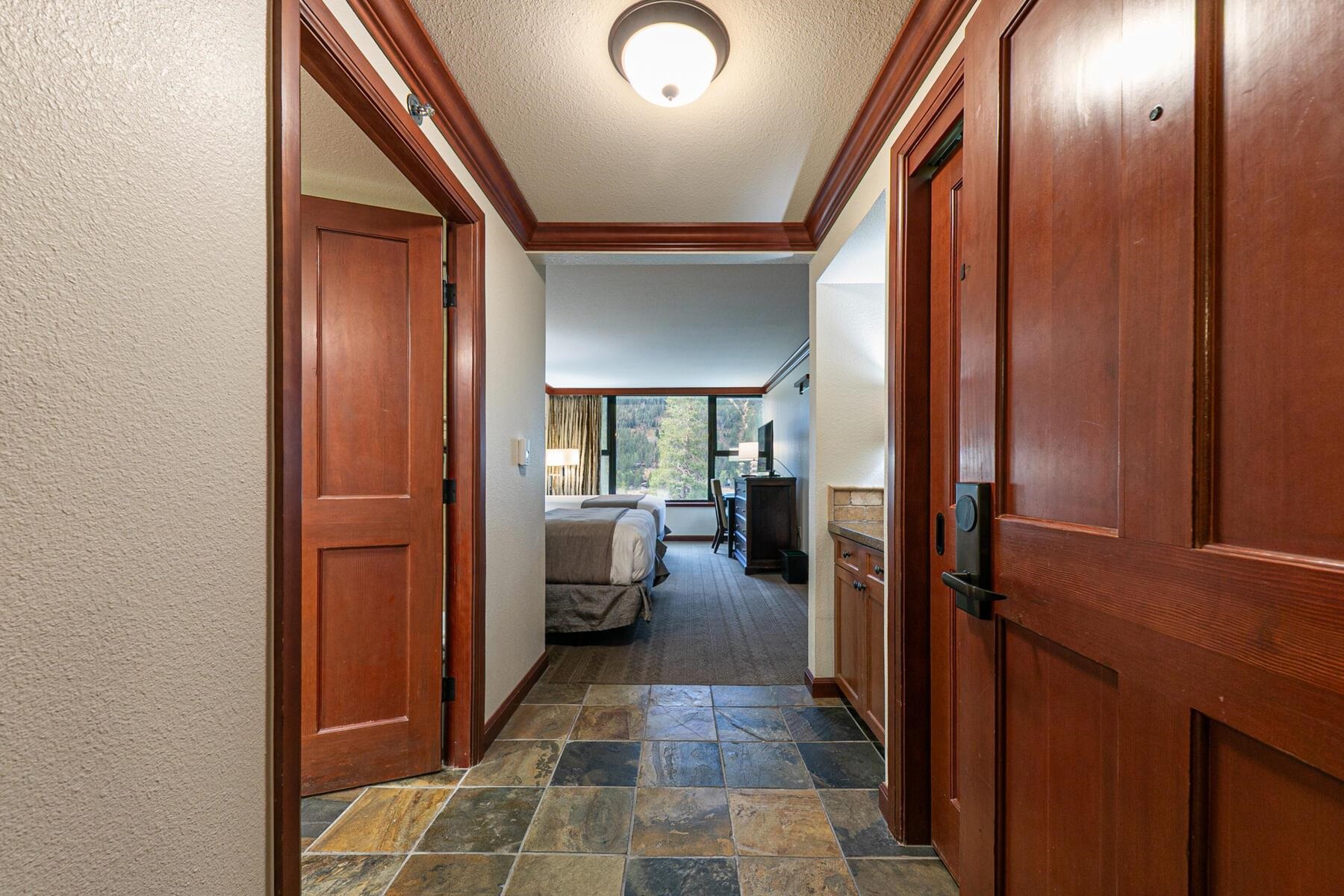 400 Resort Road, Unit 418420 Olympic Valley, CA 96146 - Photo 23 of 26 a view of a hallway with living room and furniture
