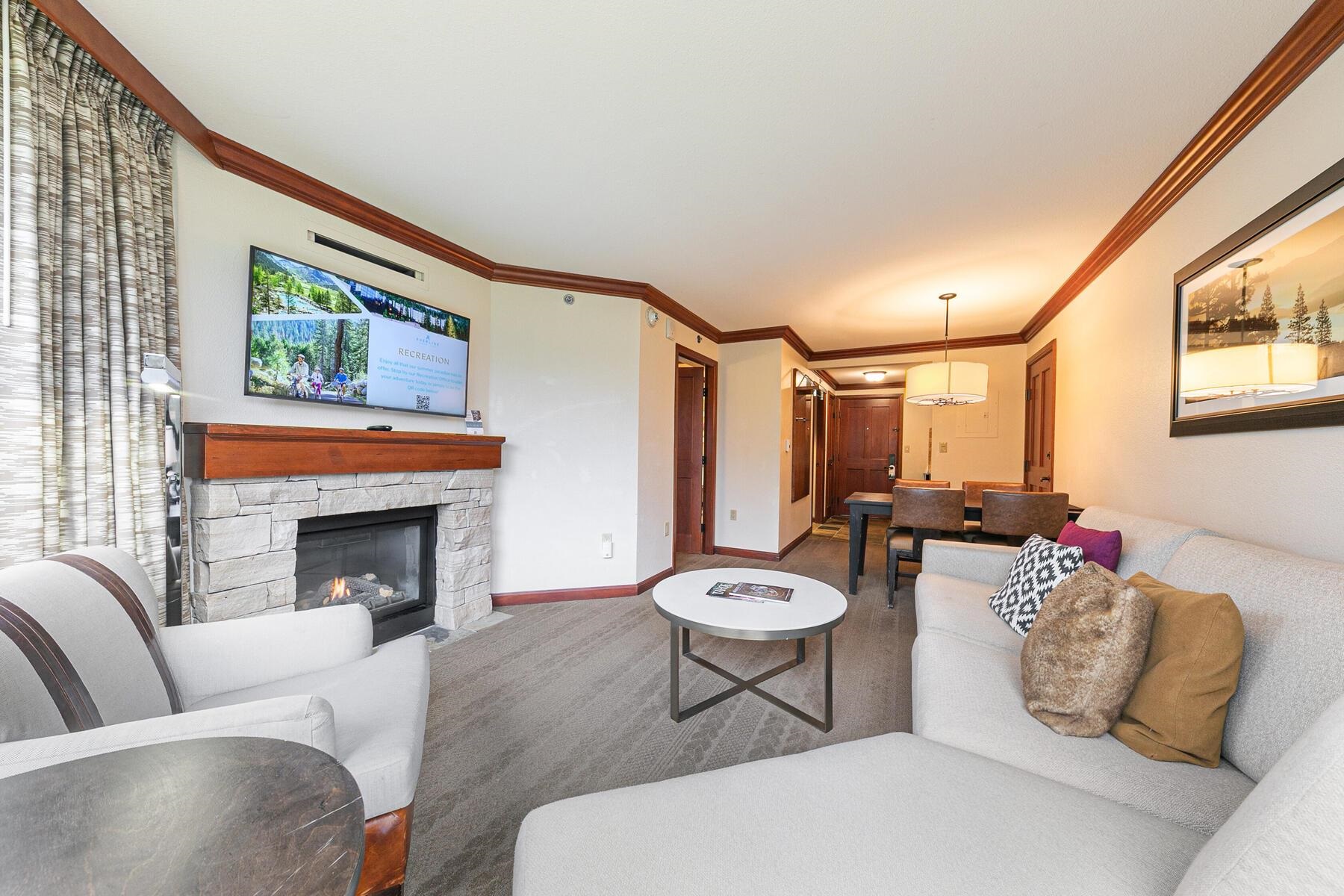 400 Resort Road, Unit 418420 Olympic Valley, CA 96146 - Photo 4 of 26 a living room with furniture and a fireplace