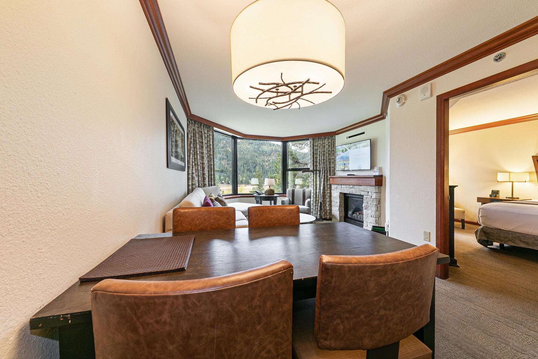 400 Resort Road, Unit 418420 Olympic Valley, CA 96146 - Photo 9 of 26 a view of an dining room with furniture wooden floor and a floor to ceiling window