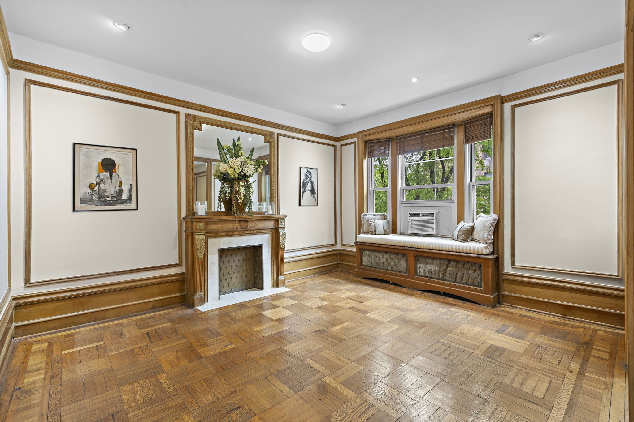 435 Convent Avenue, Unit 32 Manhattan, NY 10031 - Photo 2 of 12 a spacious bedroom with a bed and a couch