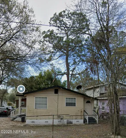 a view of a house with a tree