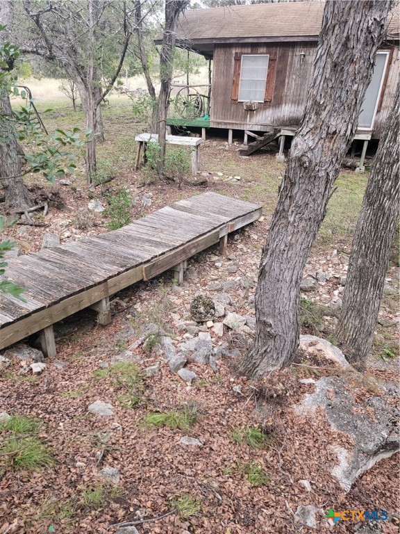 322 Cliff View Road Lampasas, TX 76550 - Photo 11 of 33 a view of a backyard with wooden fence