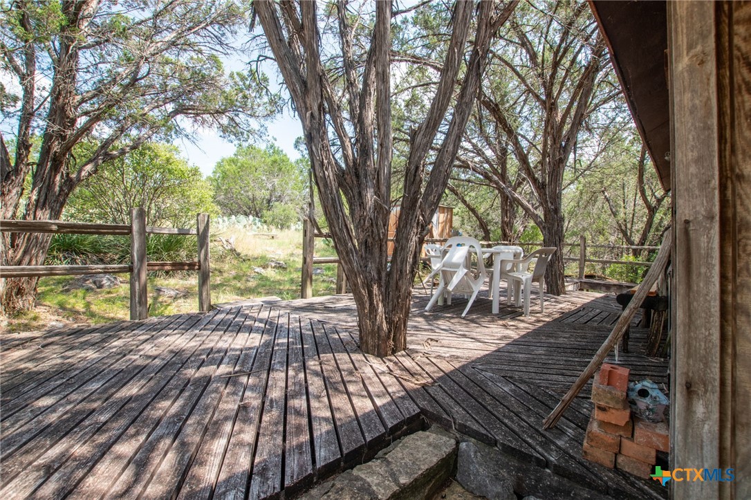 322 Cliff View Road Lampasas, TX 76550 - Photo 14 of 33 a view of balcony with wooden floor and outdoor seating