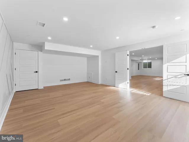 a picture of a bench in front of a wall