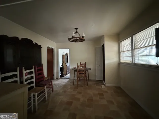 a kitchen with a sink stainless steel appliances and window