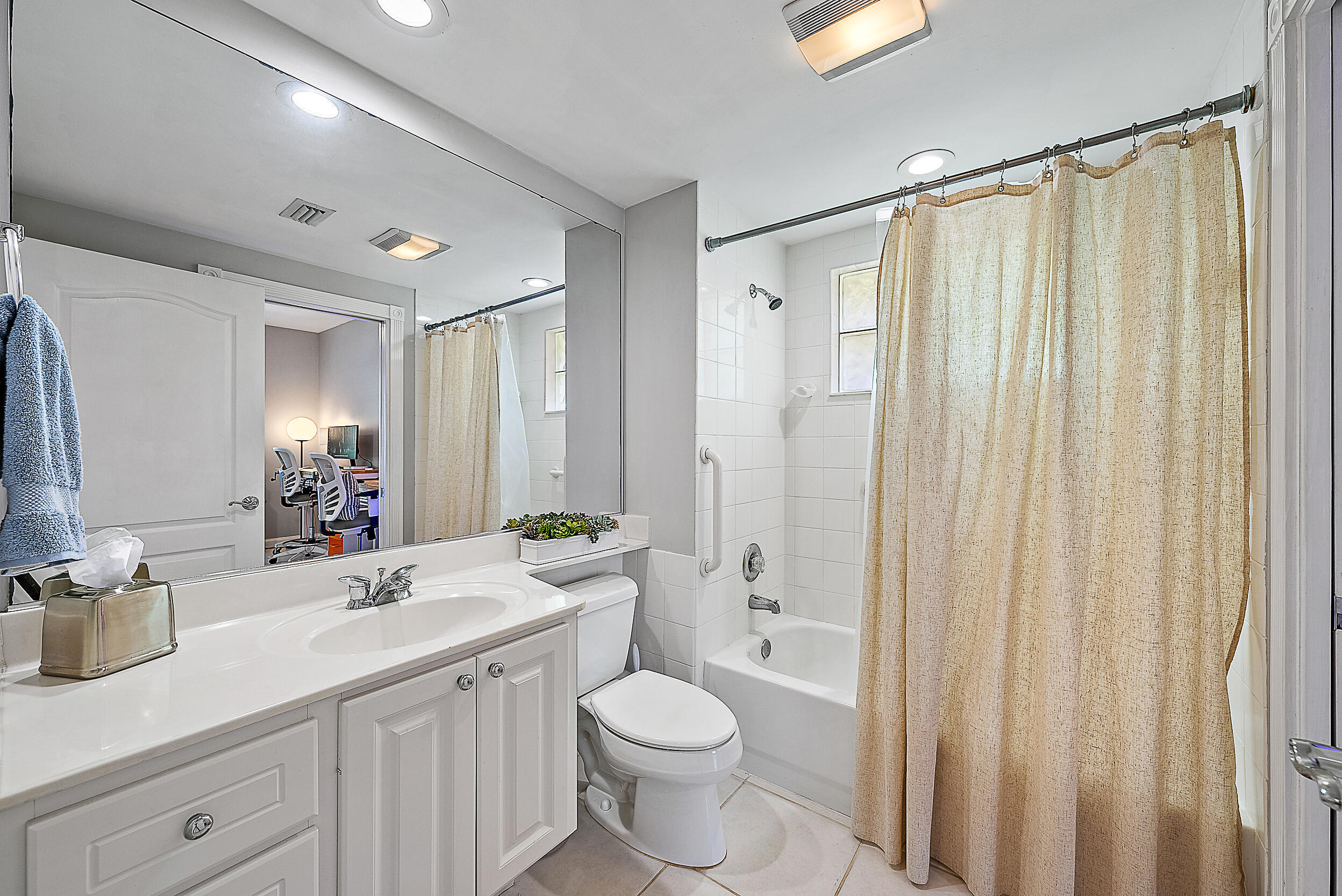 107 Rivinia Drive Jupiter, FL 33458 - Photo 13 of 28 a bathroom with a sink a toilet and shower
