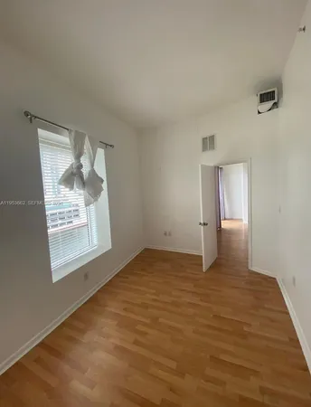 a view of an empty room and window