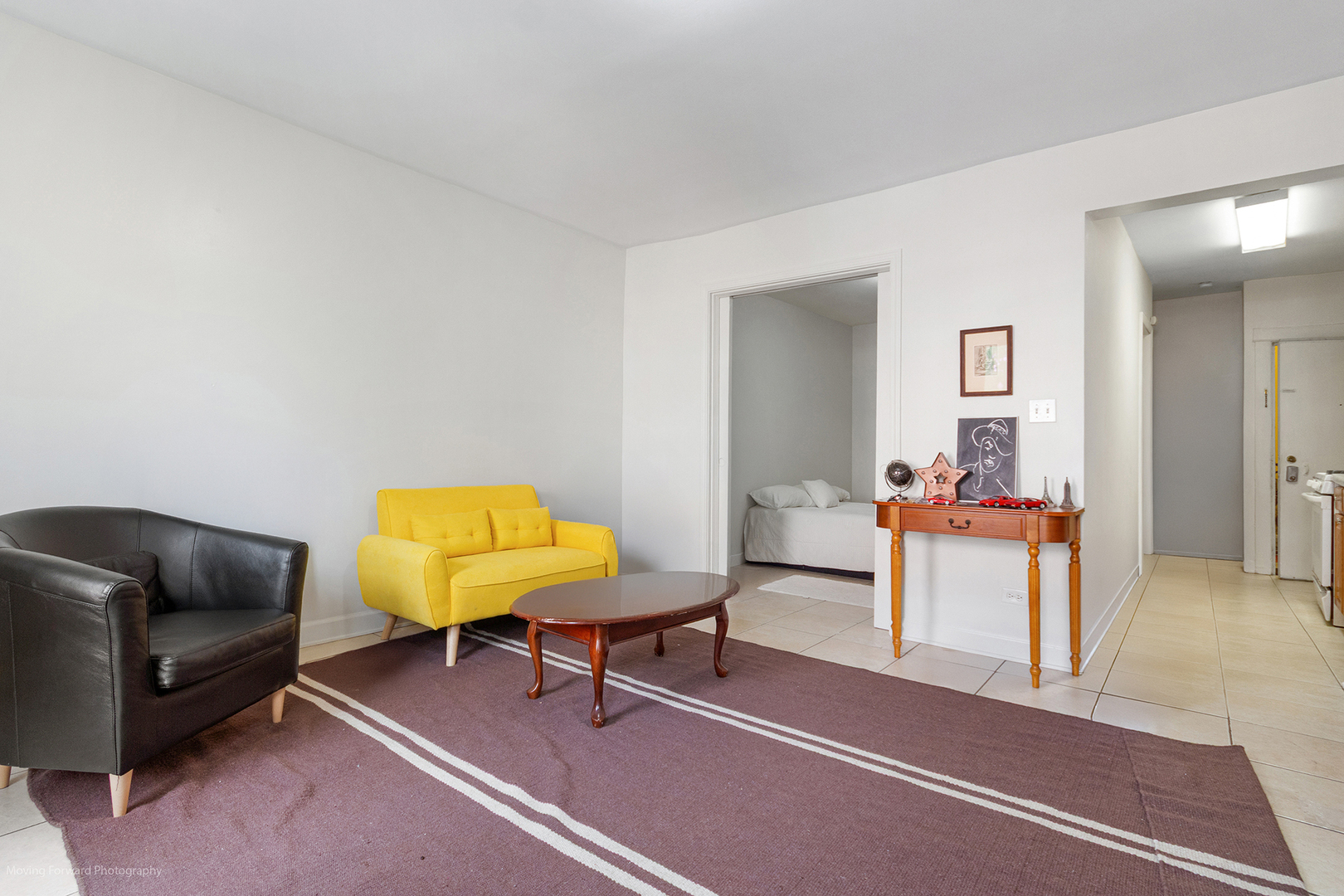 1900 South Throop Street Chicago, IL 60608 - Photo 17 of 42 a living room with furniture and a chair