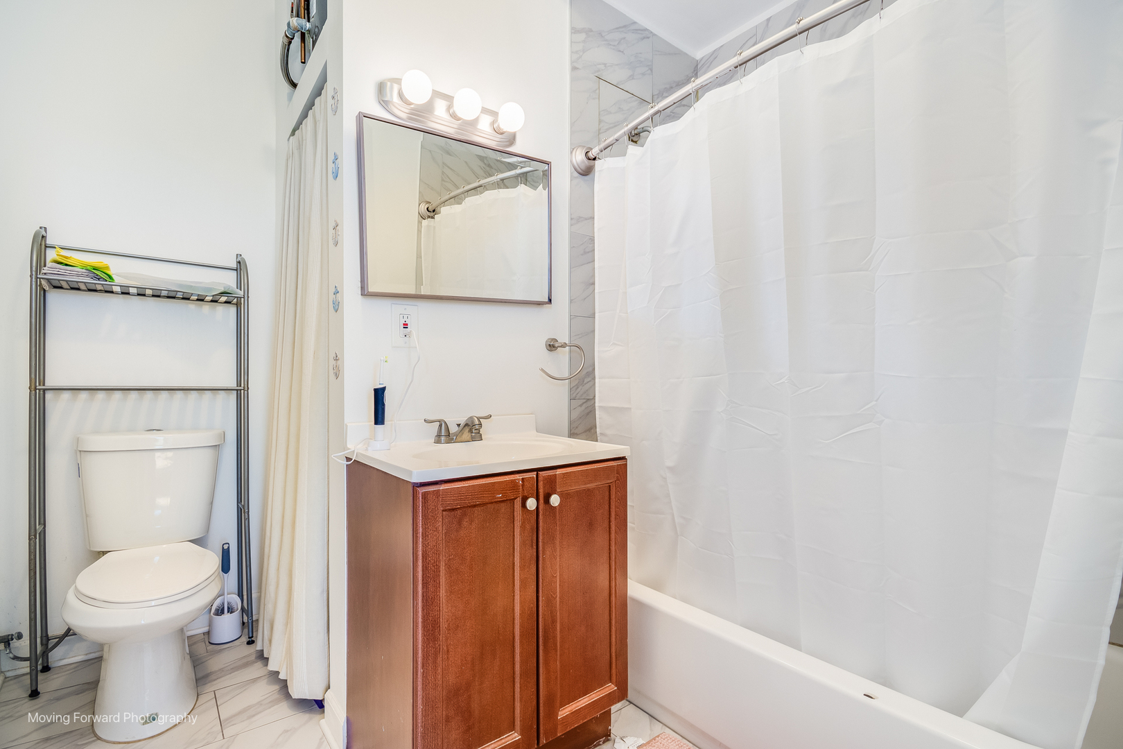 1900 South Throop Street Chicago, IL 60608 - Photo 21 of 42 a bathroom with a sink a toilet and shower