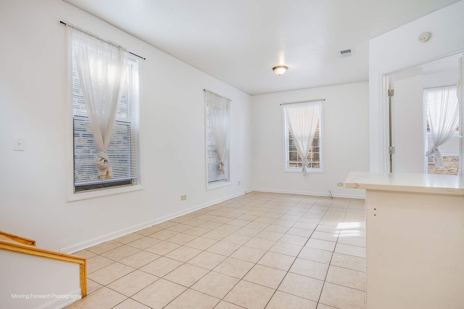 1900 South Throop Street Chicago, IL 60608 - Photo 26 of 42 a view of an empty room with window and wooden floor