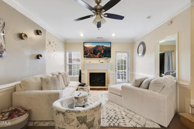 a living room with furniture and a clock