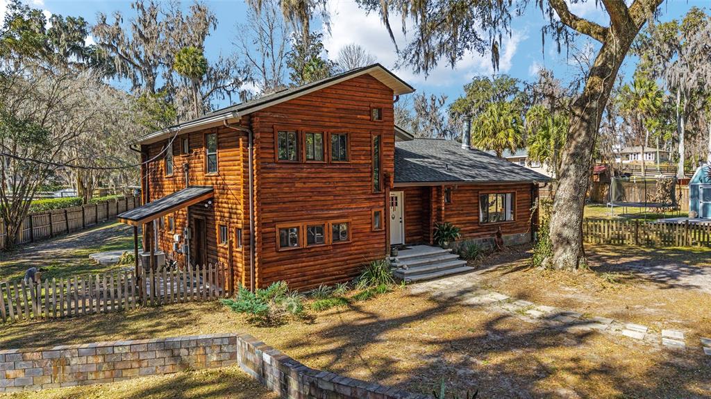 3510 Southwest 5th Court Ocala, FL 34471 - Photo 1 of 44 a front view of a house with a yard