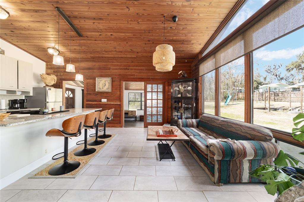 3510 Southwest 5th Court Ocala, FL 34471 - Photo 16 of 44 a living room with patio furniture and a large window
