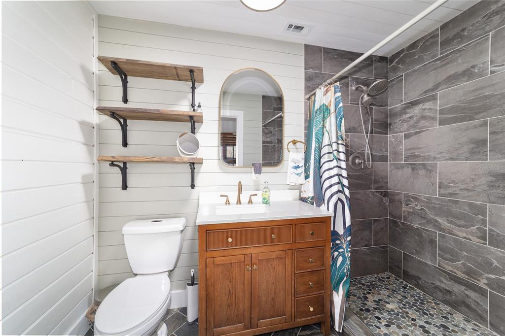 3510 Southwest 5th Court Ocala, FL 34471 - Photo 23 of 44 a bathroom with a sink a toilet and shower