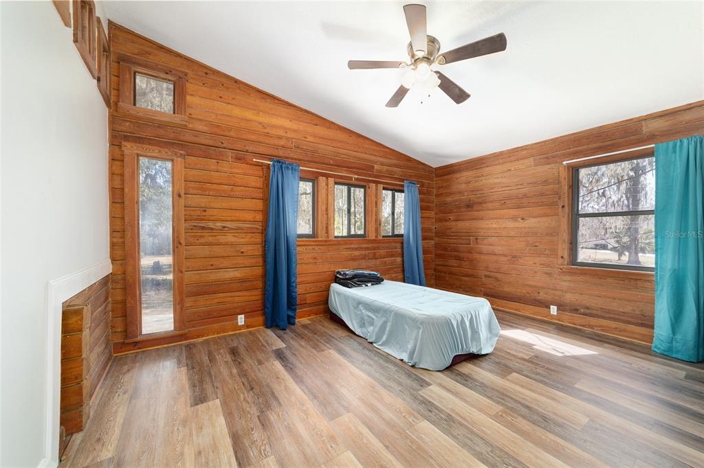 3510 Southwest 5th Court Ocala, FL 34471 - Photo 27 of 44 a bedroom with a bed and a dresser