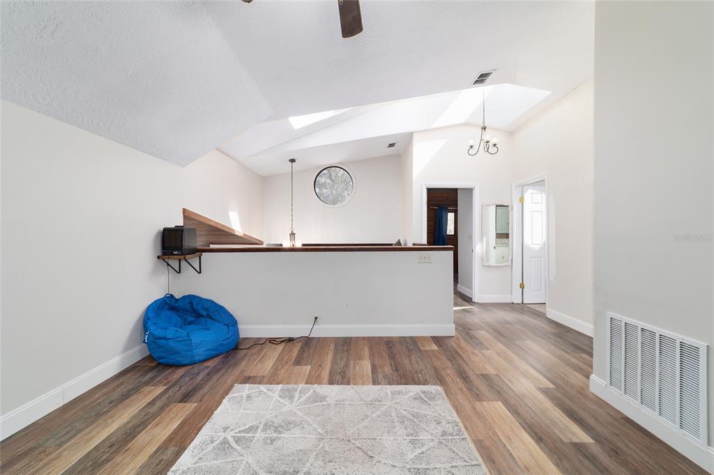 3510 Southwest 5th Court Ocala, FL 34471 - Photo 29 of 44 a view of entryway and hall with wooden floor