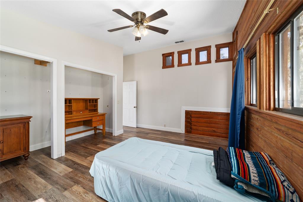 3510 Southwest 5th Court Ocala, FL 34471 - Photo 30 of 44 a bedroom with a bed and a book shelf